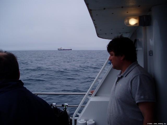 John Bricker observes freighter. Traffic is common on the "42nd Street of the North Atlantic."