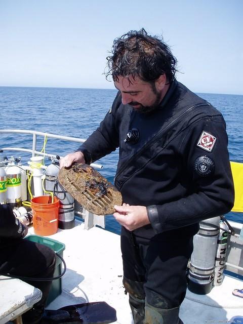 Kevin examines recovered brass vent-plate.