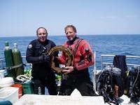 Mark and Wes with the porthole they recovered.